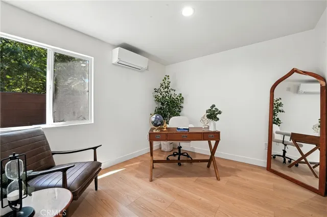 a reading room with furniture and wooden floor