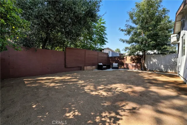 a view of a yard with a tree
