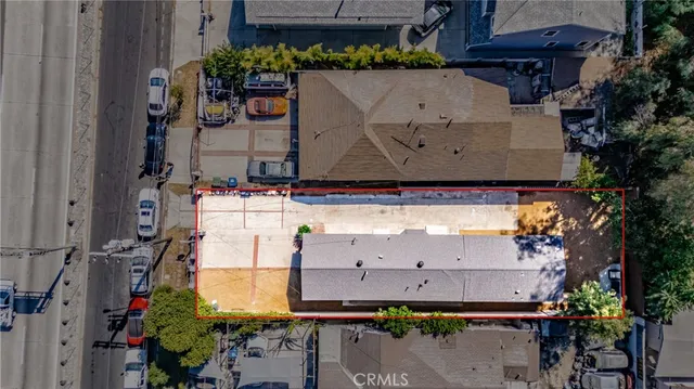 an aerial view of a house with a yard