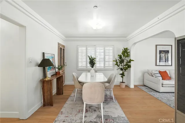 a living room with furniture fireplace and window