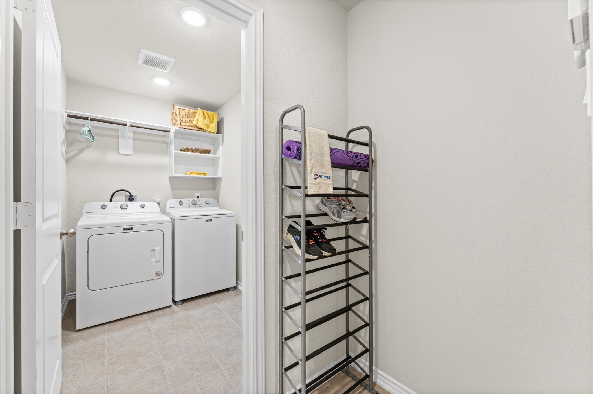 2702 Meadow View Lane Conroe, TX 77385 - Photo 5 of 26 a view of storage and utility room with washer and dryer
