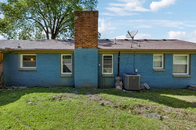 an aerial view of a house with a yard and garden