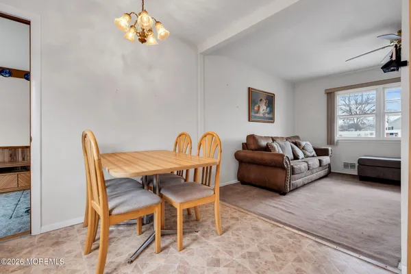 a kitchen with stainless steel appliances granite countertop a refrigerator a sink a stove and island