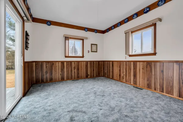 a living room with furniture and large window