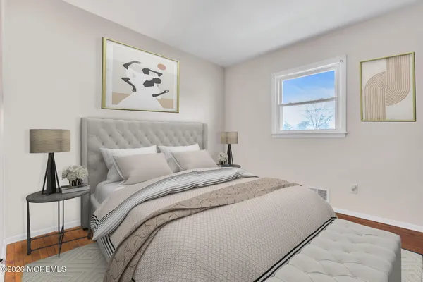 a view of a room with a sink and wooden floor