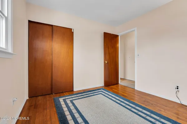 a view of a dining room with a table and chairs