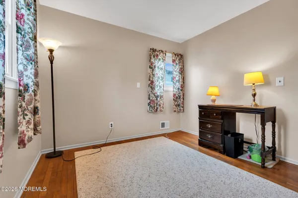 a view of a back yard of the house with green space