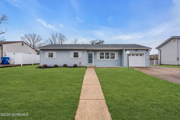 a front view of house with yard