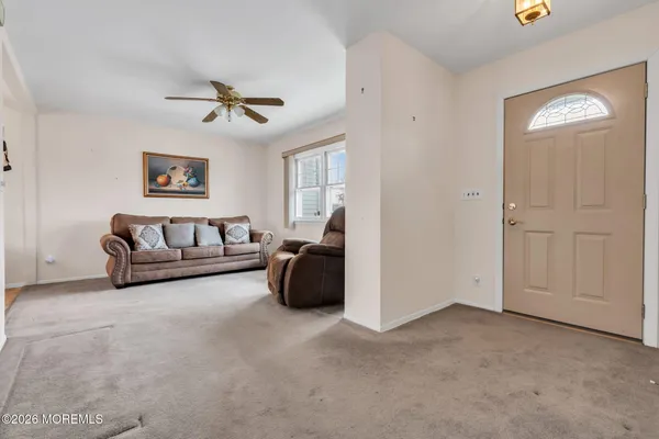a living room with furniture and a window