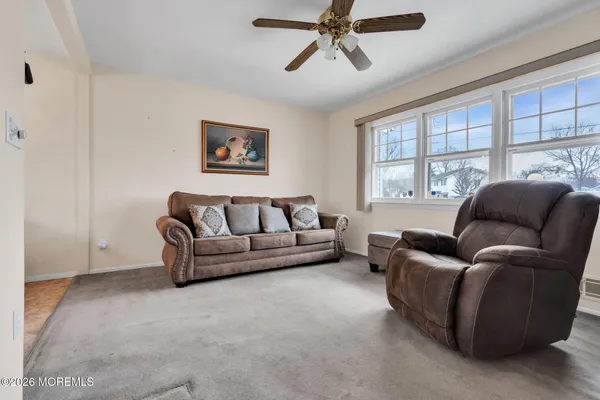 a living room with furniture and a window