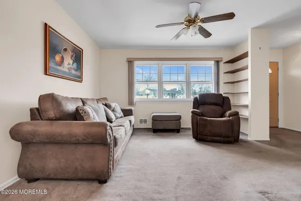 a living room with furniture and a window