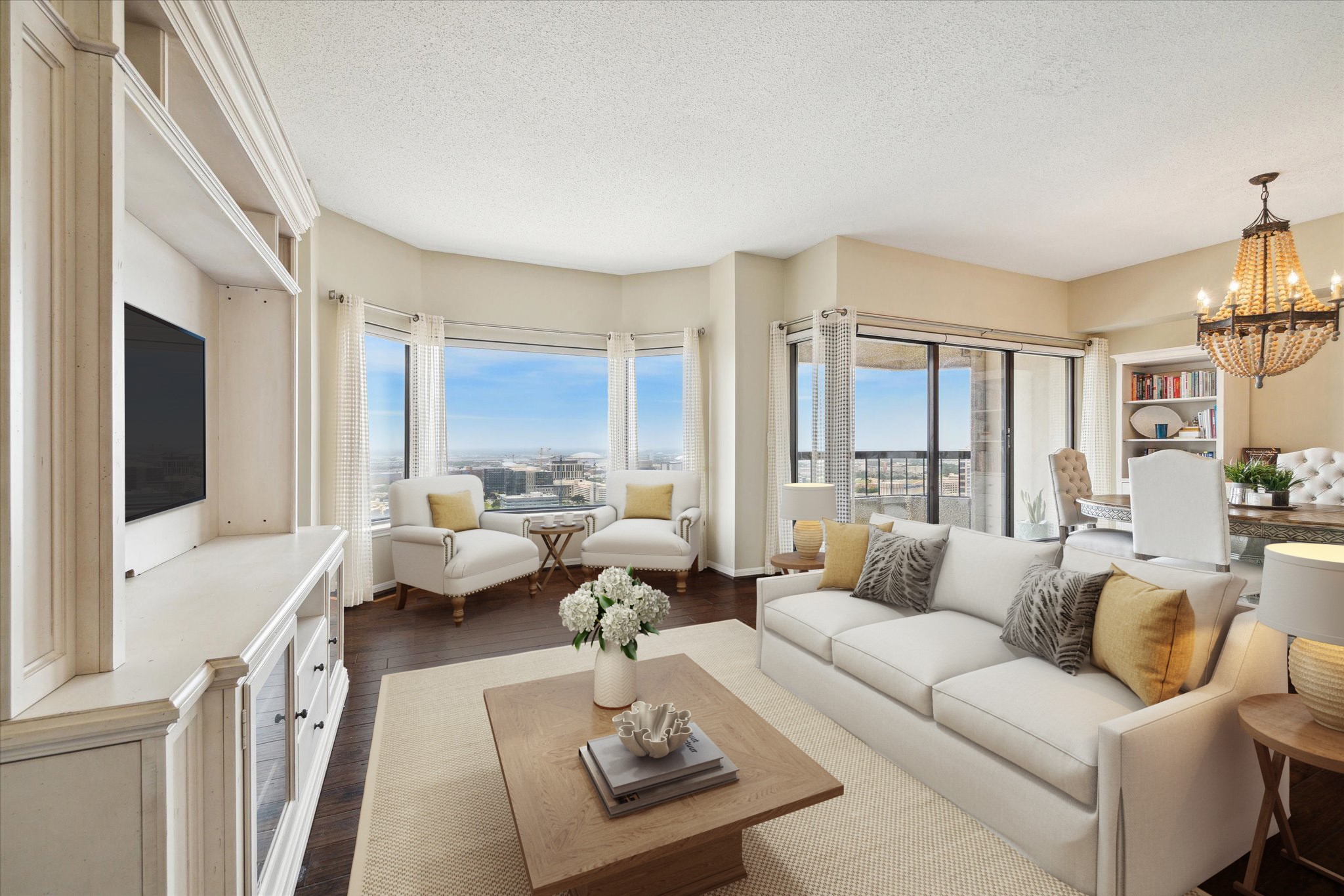 a living room with furniture couches and a flat tv screen