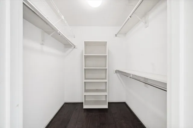a bathroom with a granite countertop sink mirror and shower