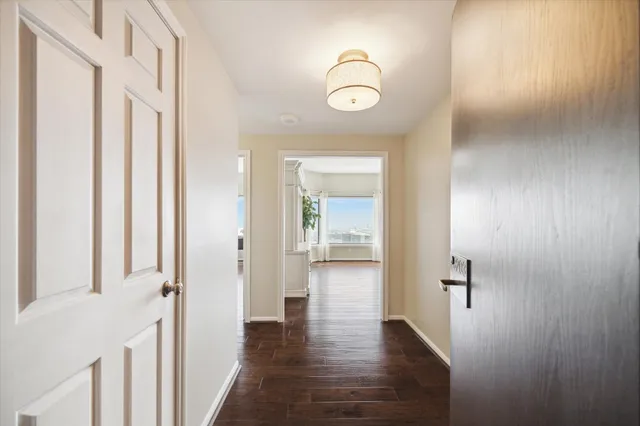 a bathroom with a granite countertop sink a toilet and a mirror