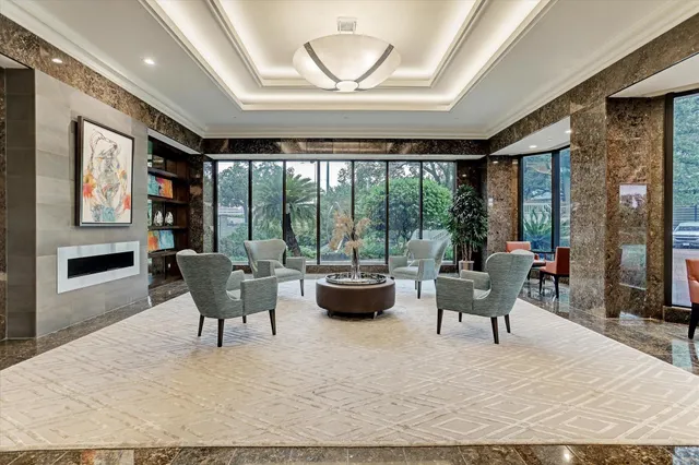 a large kitchen with sink and view of living room