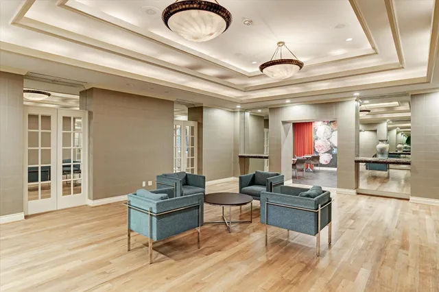 a living room with furniture kitchen view and a dining table