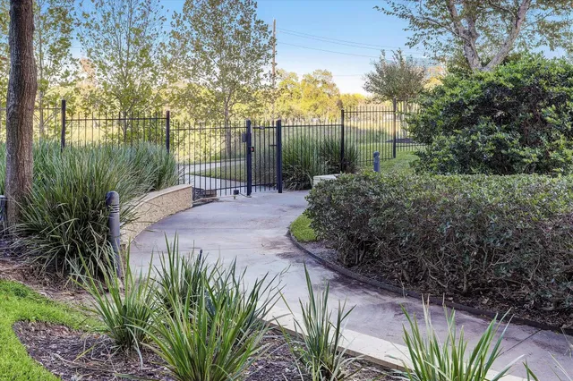 a view of swimming pool with outdoor seating and plants
