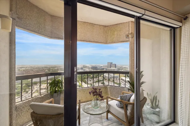 a view of a room with furniture and windows