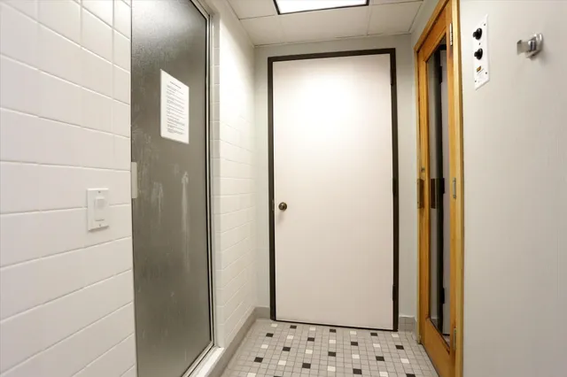 a room with table tennis table and a chandelier