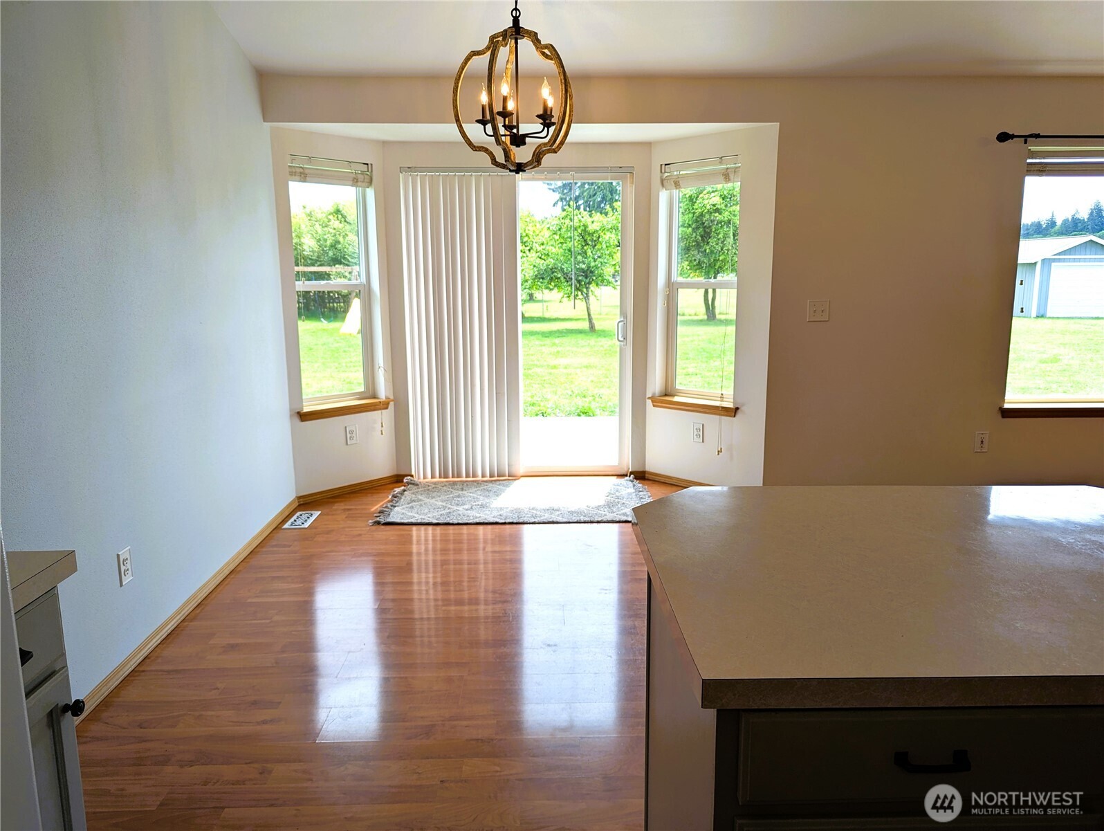 9441 180th Way Southwest Rochester, WA 98579 - Photo 11 of 37 a view of a room with a window and wooden floor