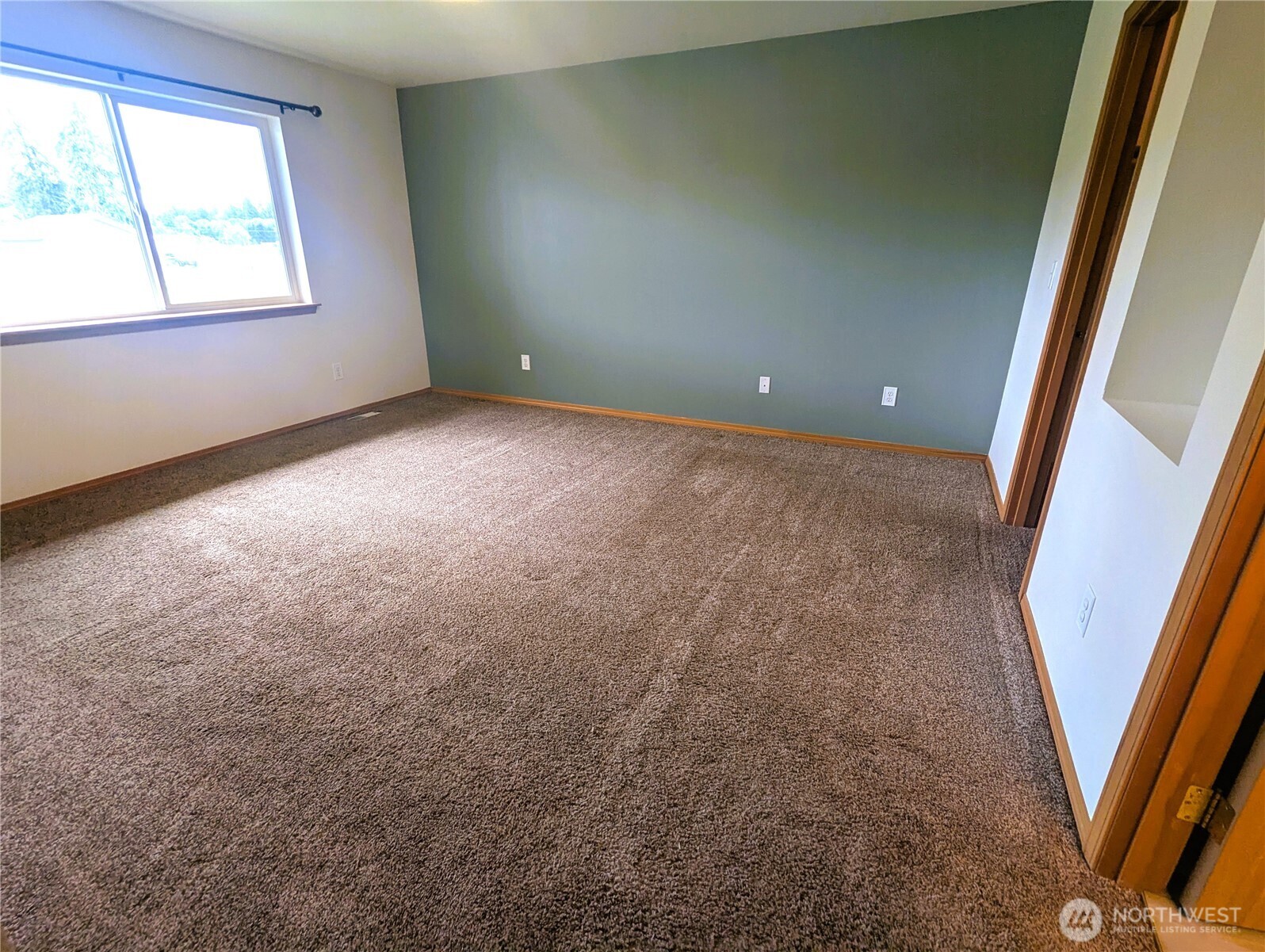 9441 180th Way Southwest Rochester, WA 98579 - Photo 20 of 37 an empty room with windows