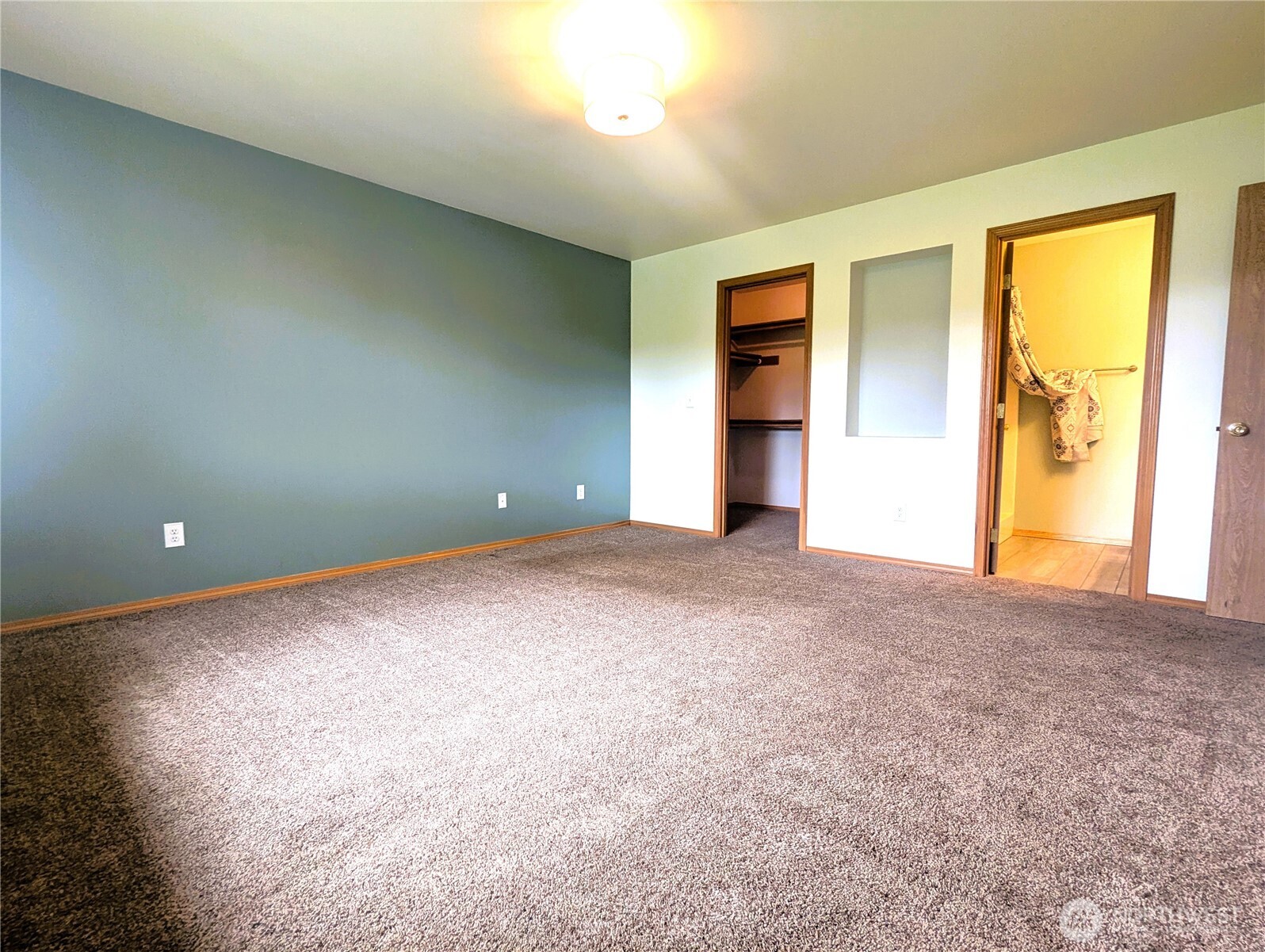 9441 180th Way Southwest Rochester, WA 98579 - Photo 21 of 37 a view of an empty room with a window