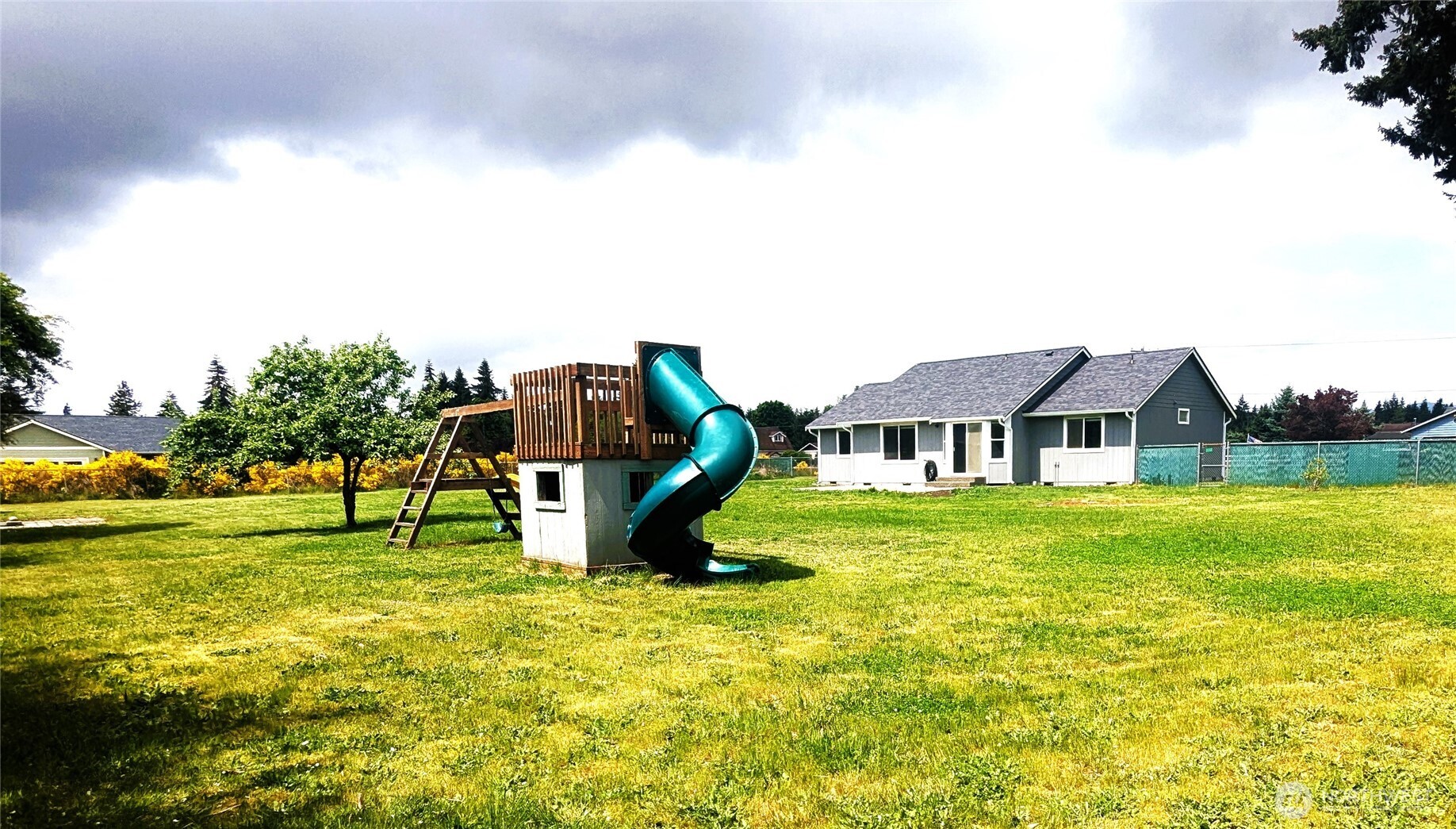 9441 180th Way Southwest Rochester, WA 98579 - Photo 29 of 37 a view of a house with a big yard