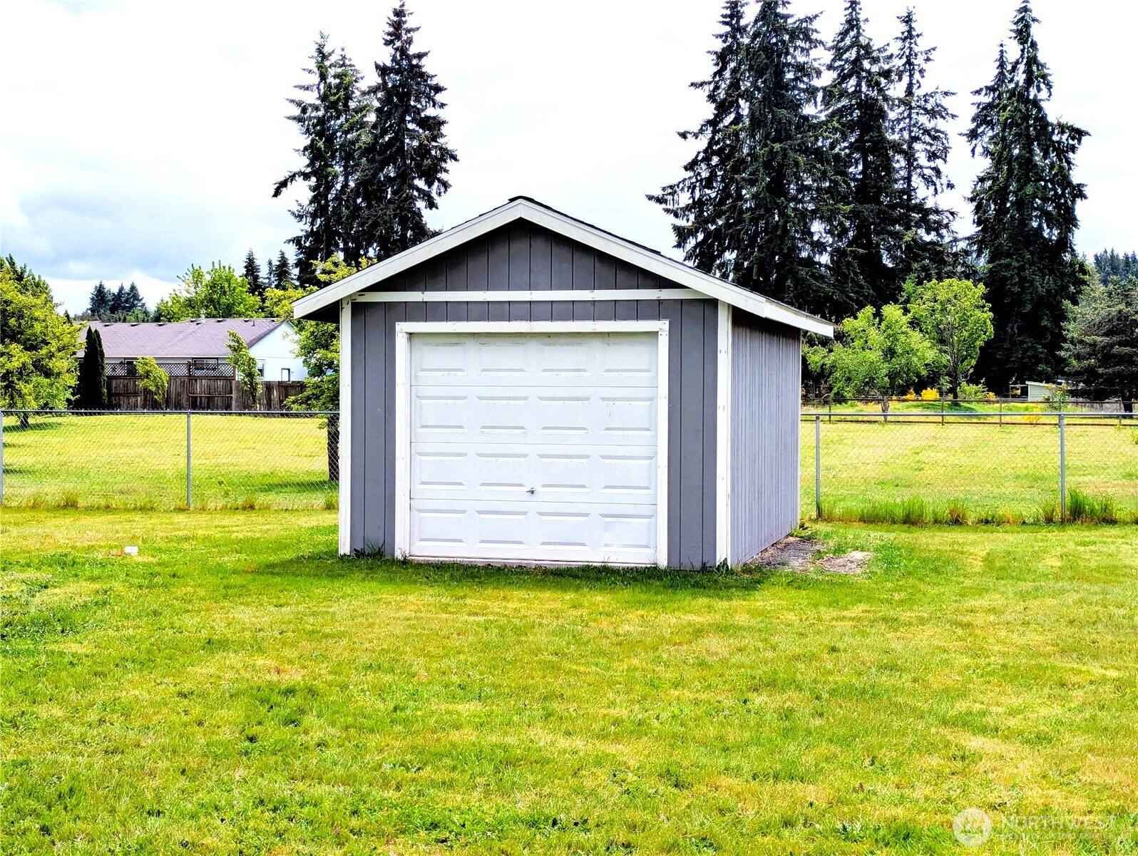 9441 180th Way Southwest Rochester, WA 98579 - Photo 36 of 37 a view of an house with backyard space and garden