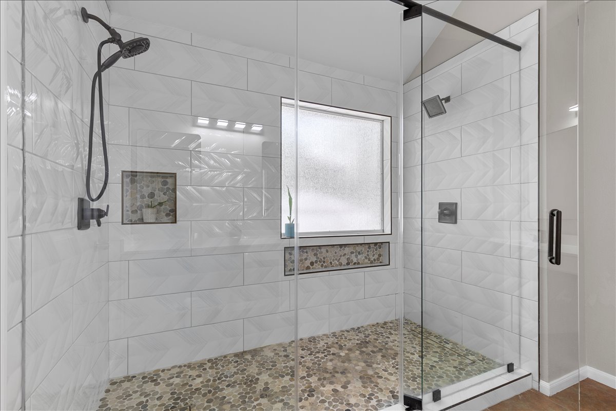 9012 Meacham Way Austin, TX 78749 - Photo 20 of 34 Walk-in shower with clear glass enclosure and black hardware