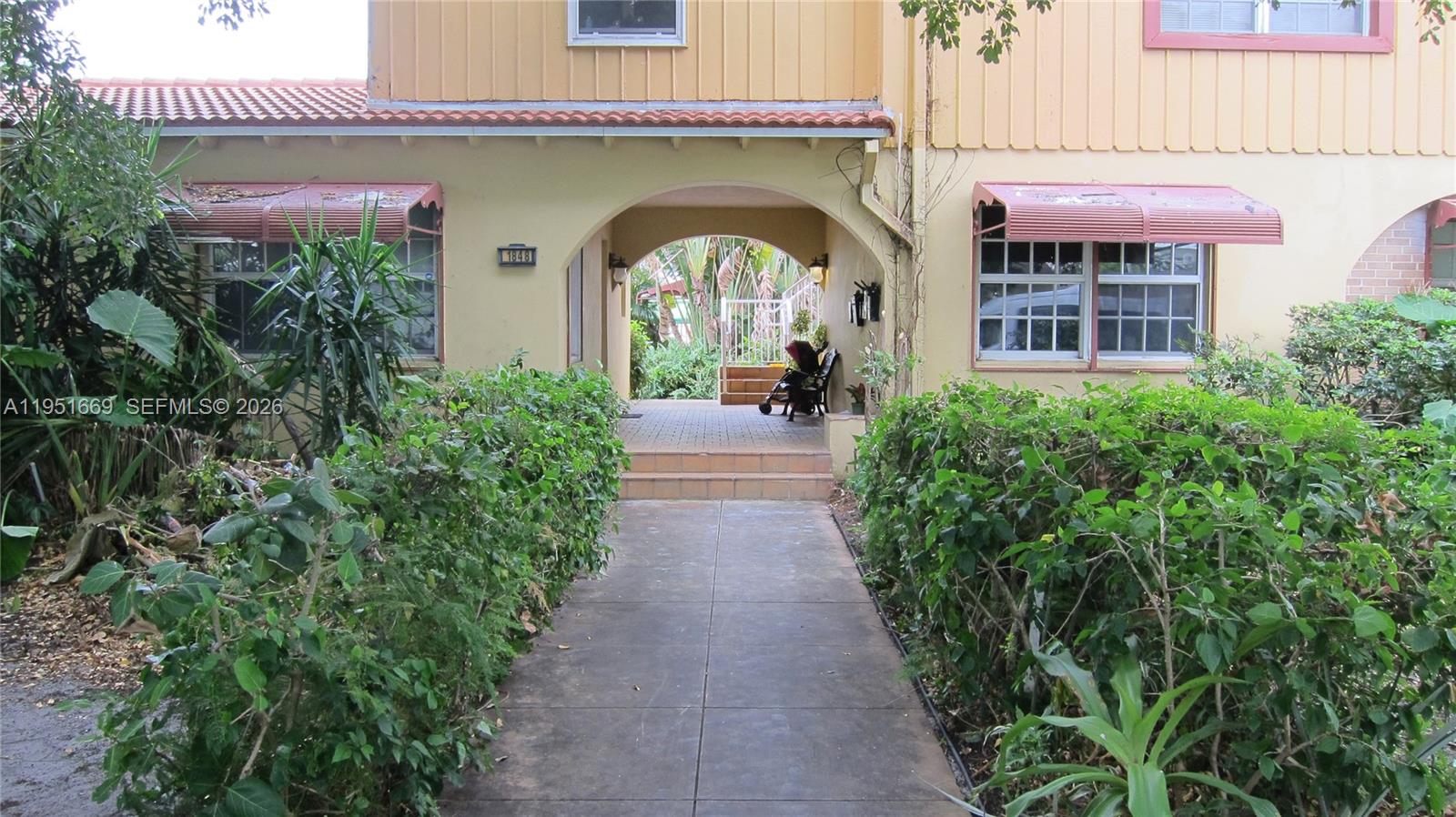 1848 Madison Street, Unit 3 Hollywood, FL 33020 - Photo 1 of 11 a front view of a house with garden