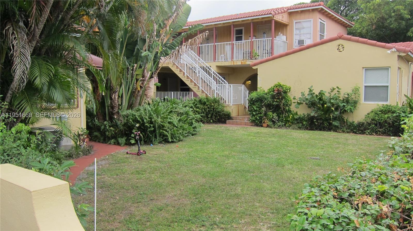 1848 Madison Street, Unit 3 Hollywood, FL 33020 - Photo 11 of 11 a front view of a house with a yard