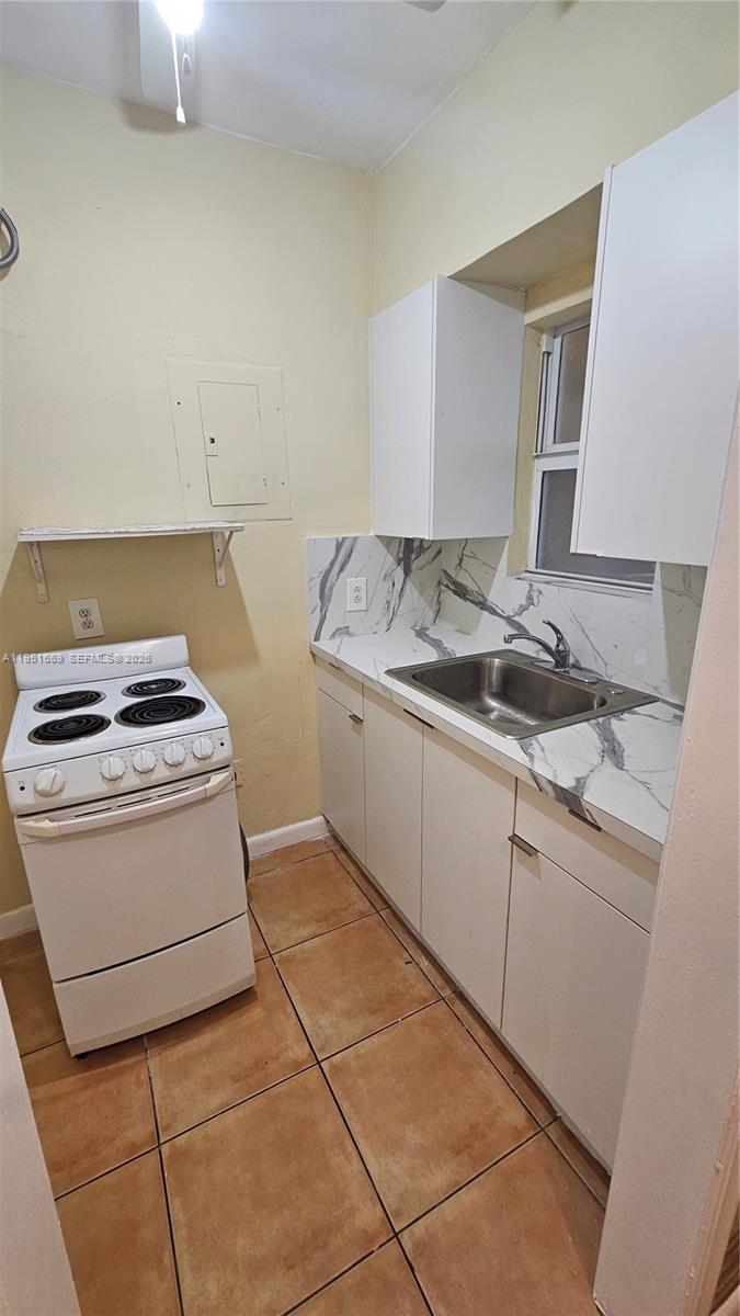 1848 Madison Street, Unit 3 Hollywood, FL 33020 - Photo 10 of 11 a utility room with stove dryer and washer