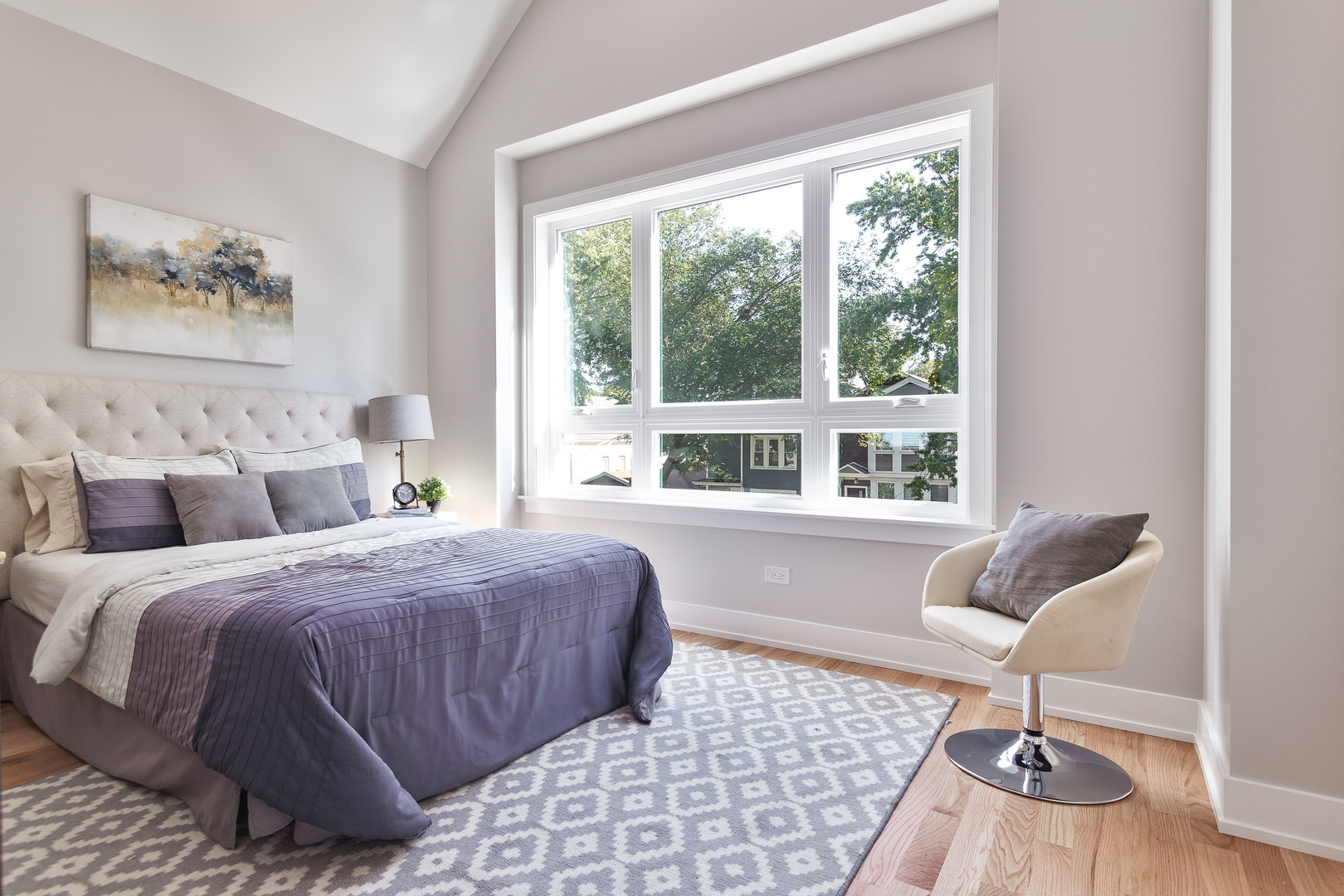 4602 North Springfield Avenue Chicago, IL 60625 - Photo 18 of 30 a bedroom with double bed and a window