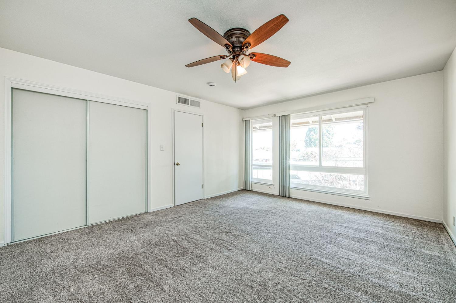 6656 North 3rd Street Fresno, CA 93710 - Photo 18 of 31 a view of an empty room with a window