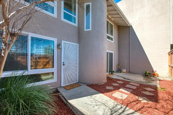 a view of an entryway with wooden floor