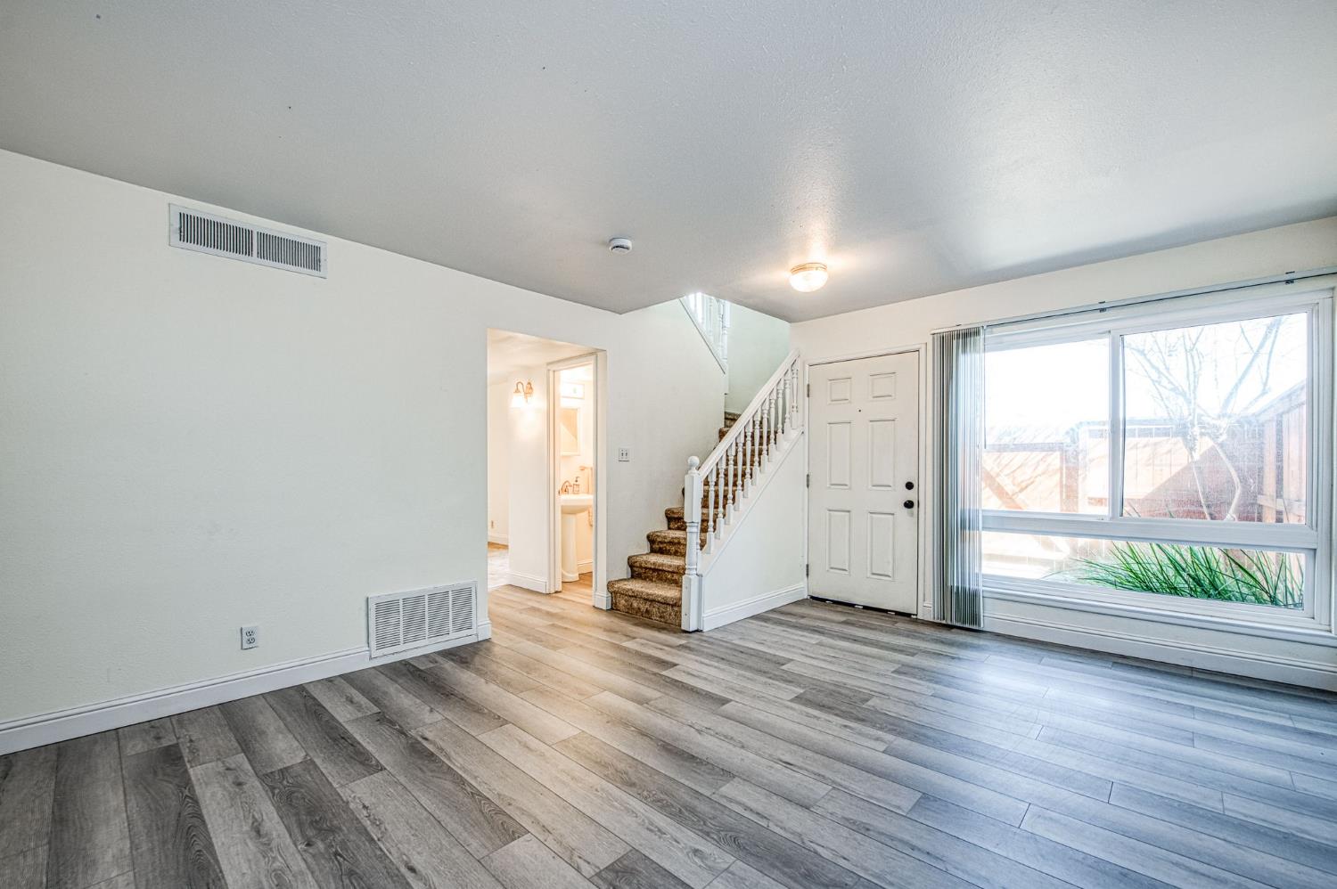 6656 North 3rd Street Fresno, CA 93710 - Photo 4 of 31 a view of an entryway with wooden floor