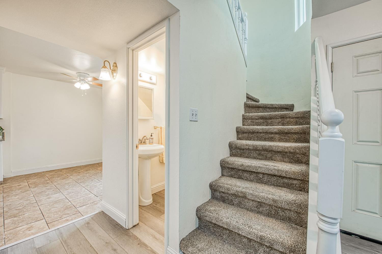 6656 North 3rd Street Fresno, CA 93710 - Photo 6 of 31 a view of entryway with wooden floor and stairs