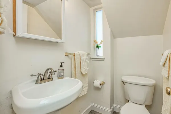 a view of an empty room and window ceiling fan