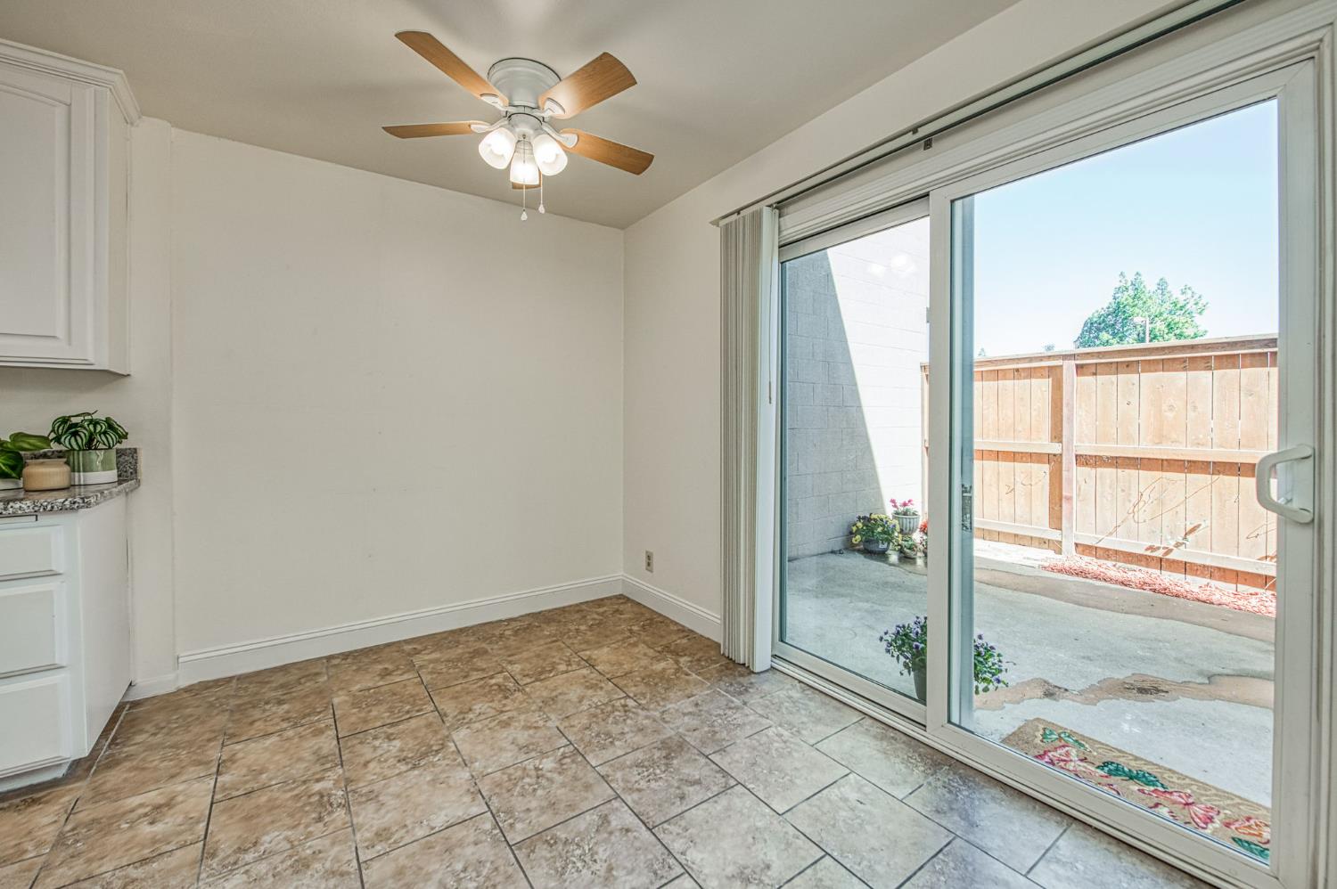 6656 North 3rd Street Fresno, CA 93710 - Photo 8 of 31 a view of an empty room and window ceiling fan
