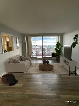 a room with furniture pool table and window