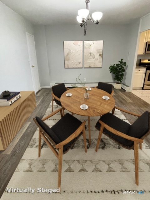 65 Glenbrook Road, Unit 12D Stamford, CT 06902 - Photo 2 of 5 a room with furniture pool table and window