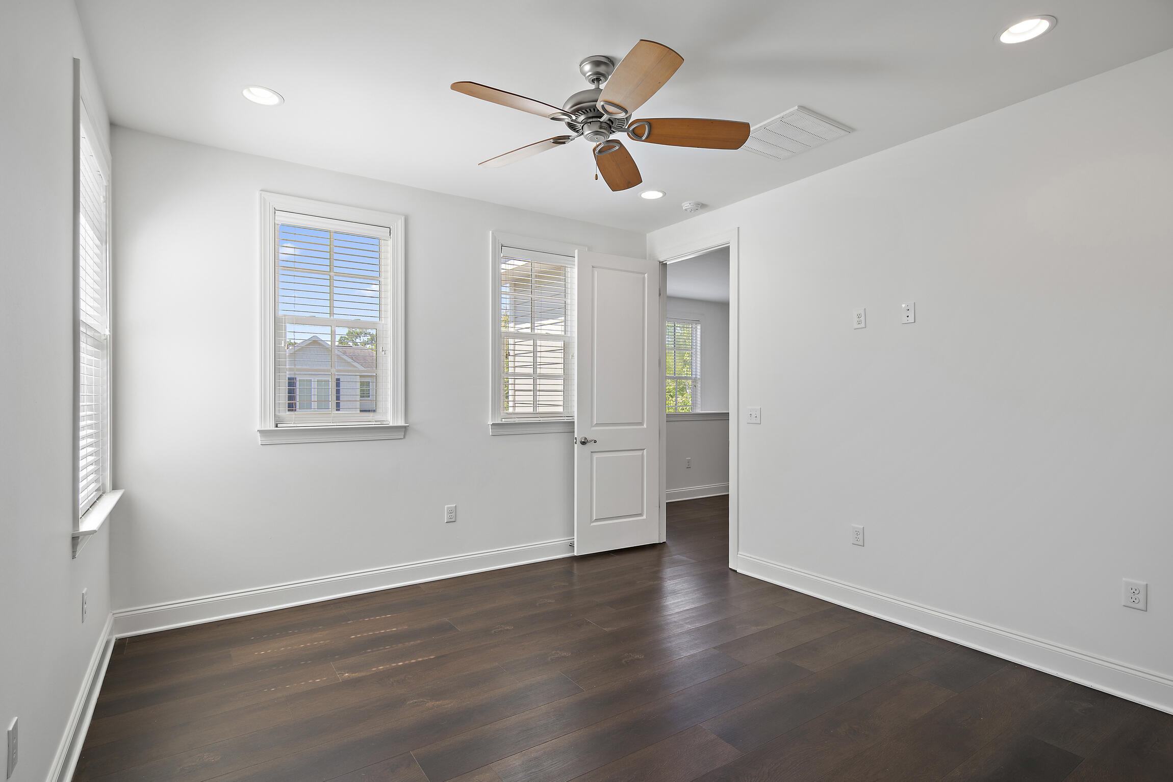 193 Christian Drive Santa Rosa Beach, FL 32459 - Photo 29 of 41 an empty room with wooden floor and ceiling fan