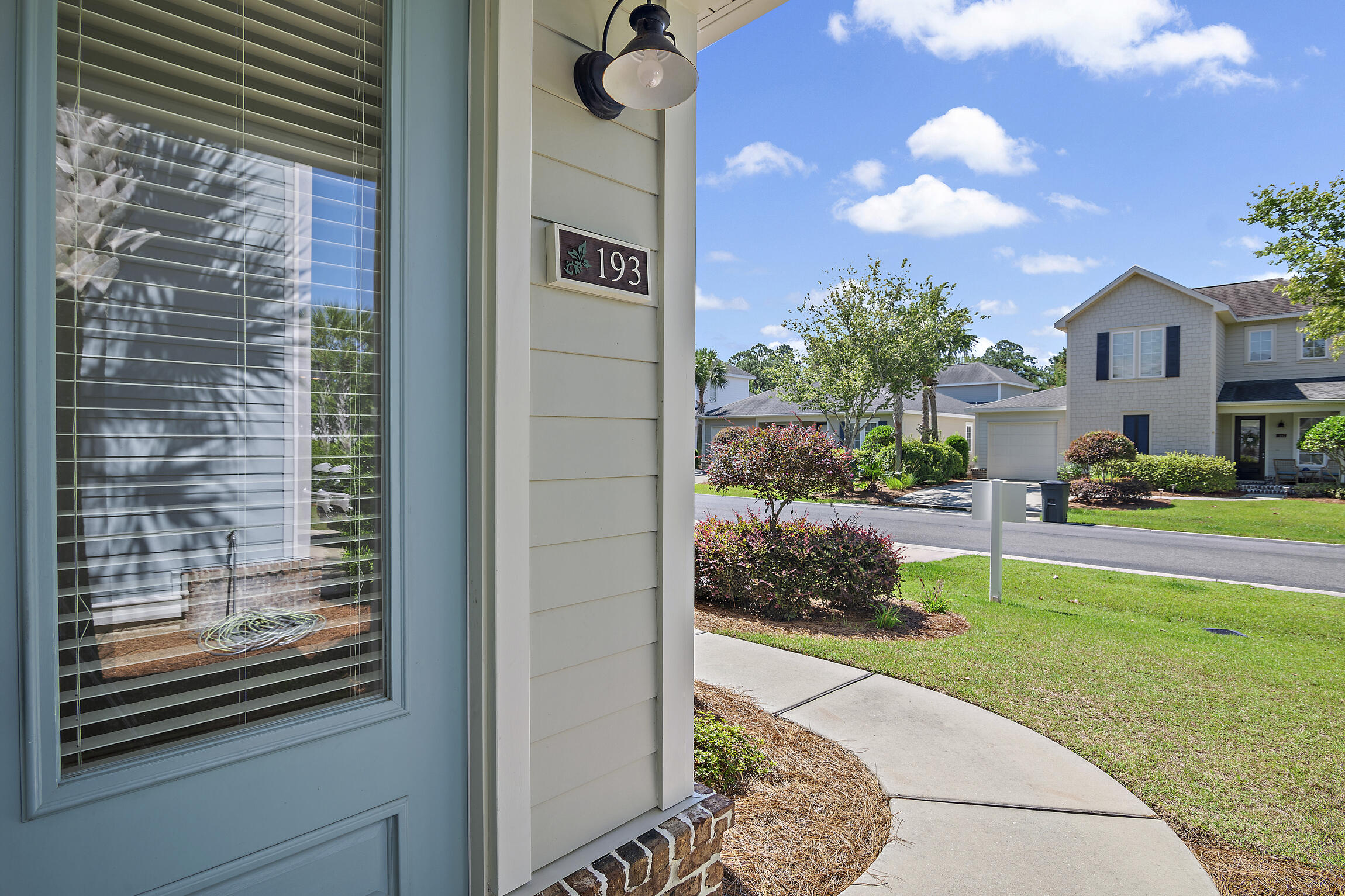 193 Christian Drive Santa Rosa Beach, FL 32459 - Photo 3 of 41 a view of a house with a garden and pathway