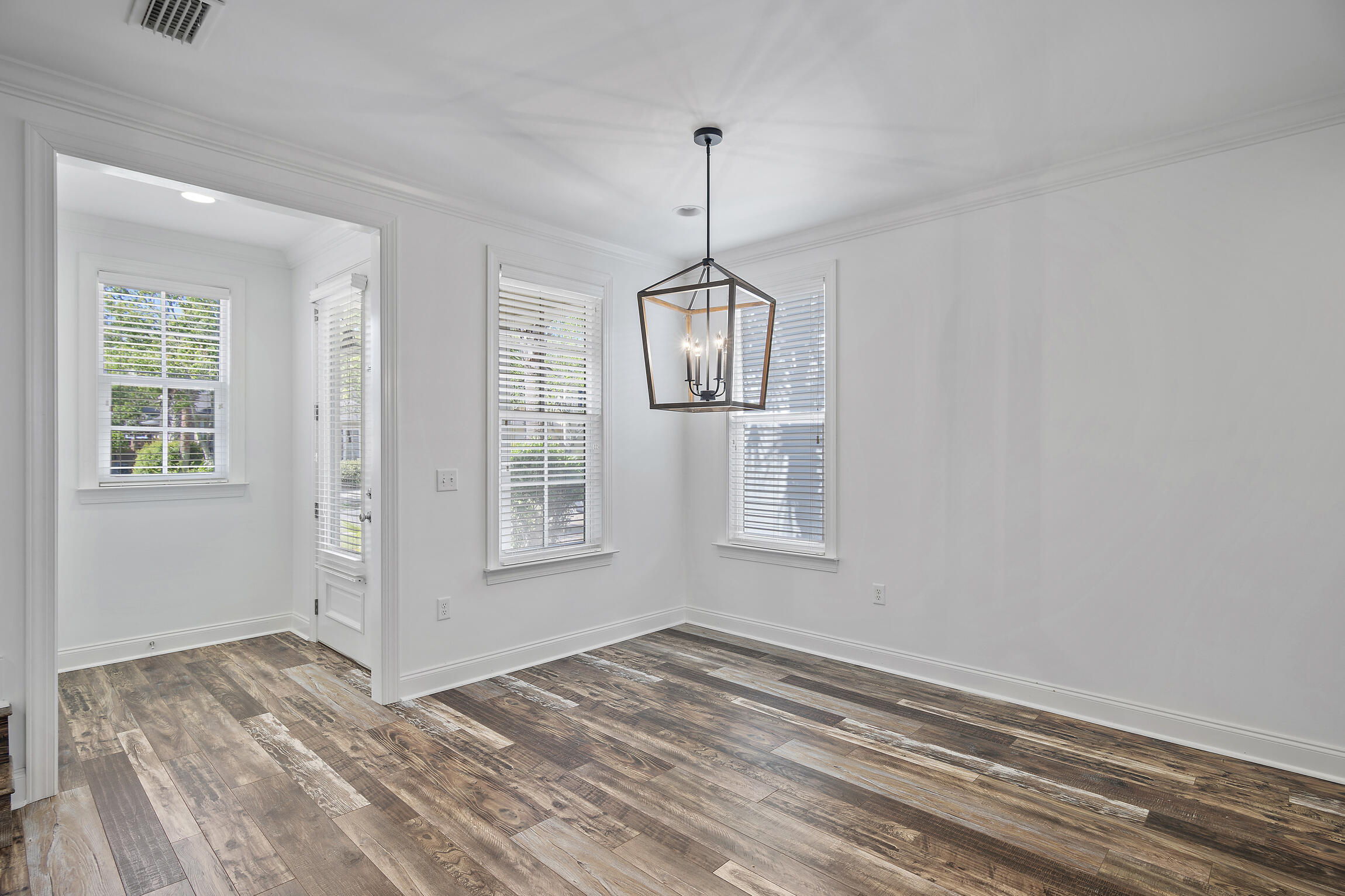 193 Christian Drive Santa Rosa Beach, FL 32459 - Photo 6 of 41 a view of empty room with wooden floor and fan