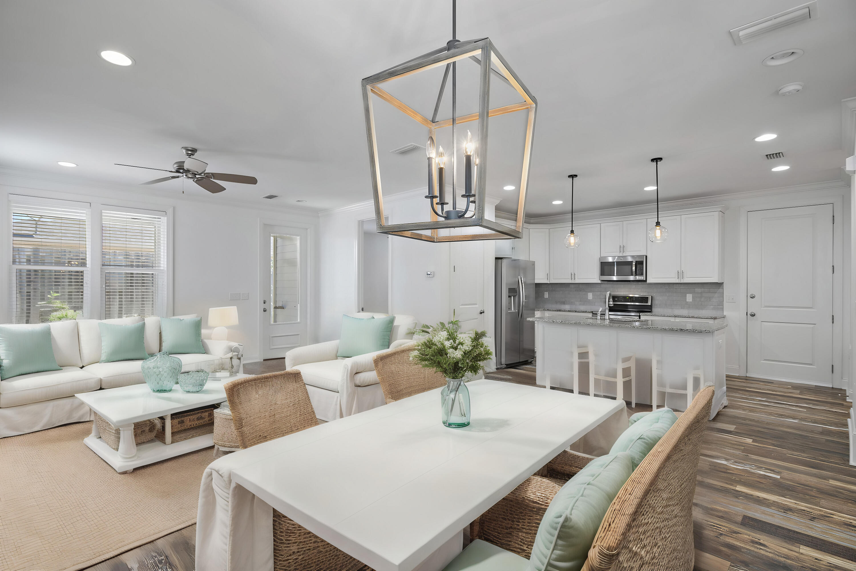 193 Christian Drive Santa Rosa Beach, FL 32459 - Photo 7 of 41 a living room with kitchen island furniture a chandelier and kitchen view
