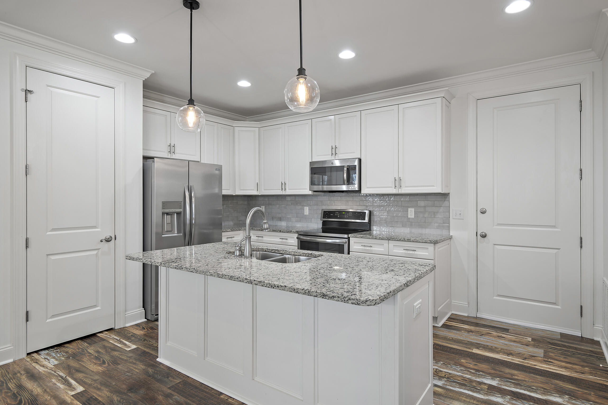193 Christian Drive Santa Rosa Beach, FL 32459 - Photo 10 of 41 a kitchen with stainless steel appliances granite countertop a refrigerator a sink and a stove