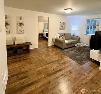 a living room with furniture and a table