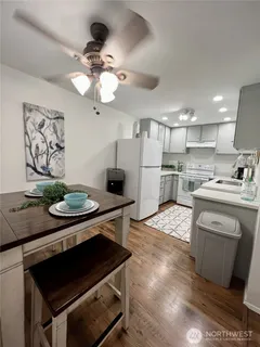 a kitchen with a stove and a refrigerator