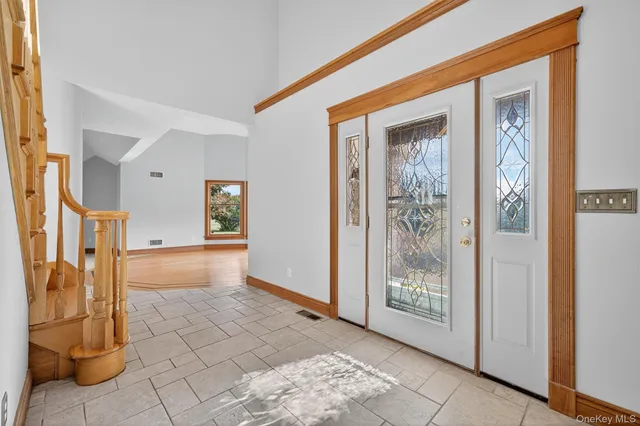 a view of entryway with a front door