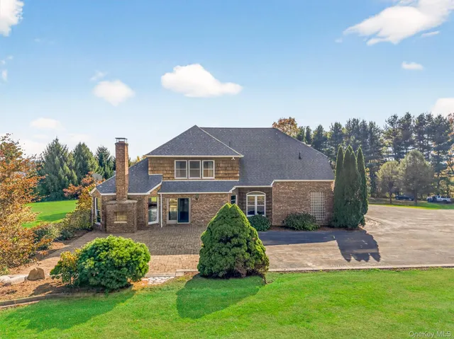 a view of a house with a street